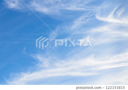White clouds in a bright blue sky. The beauty of the nature 122153815