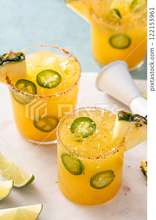 Pineapple margarita with spiced rim and jalapeno slices Pineapple margarita with spiced rim and jalapeno slices 122153961