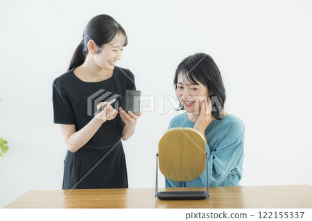 A beauty consultant applying makeup A beauty consultant applying makeup 122155337