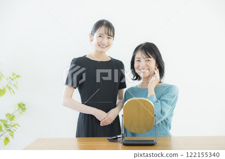 A beauty consultant applying makeup A beauty consultant applying makeup 122155340