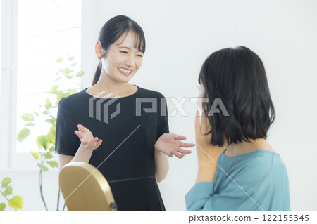 A beauty consultant applying makeup A beauty consultant applying makeup 122155345