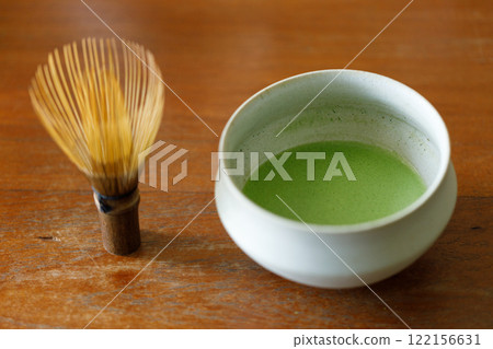 Cup of fresh matcha tea, green tea on wooden table Cup of fresh matcha tea, green tea on wooden table 122156631