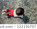 Summer memories of a girl playing in the sea 122156707