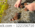Autumn memories of a girl playing with nuts 122156710