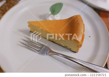 Handmade baked cheesecake served on ceramic ware Handmade baked cheesecake served on ceramic ware 122156721