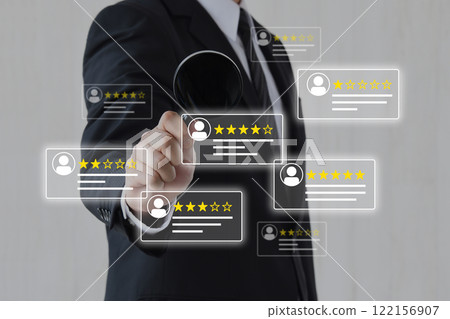 Businessman analyzing customer reviews with a magnifying glass Businessman analyzing customer reviews with a magnifying glass 122156907