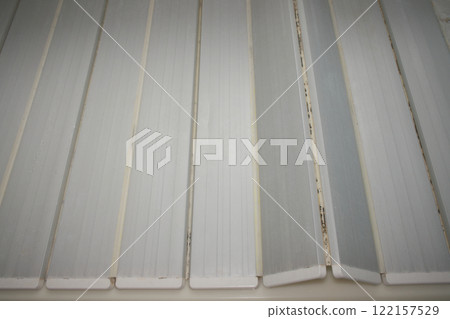 Black mold growing on the bathtub lid Black mold growing on the bathtub lid 122157529