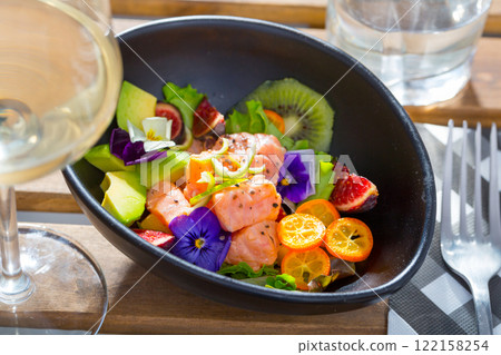 Ceviche of salmon with kiwi fruit, avocado, kumquat, figs Ceviche of salmon with kiwi fruit, avocado, kumquat, figs 122158254