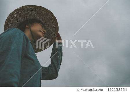 Rain clouds and farmer 122158264