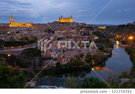 Toledo cityscape with lighted Cathedral and Alcazar in spring twilight Toledo cityscape with lighted Cathedral and Alcazar in spring twilight 122158391