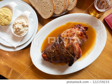 Delicious grilled knuckle of pork with horseradish and mustard.  122159233