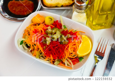 Seasonal vegetable salad with carrot and cucumber Seasonal vegetable salad with carrot and cucumber 122159332