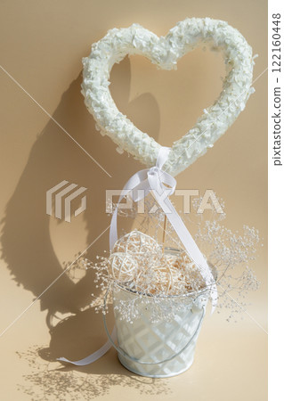 White lilac flowers heart shaped decor for present gift in pastel backdrop. Symbol of love floral arrangement. Spring concept idea Valentine's Day, weeding proposal postcard copy space 122160448