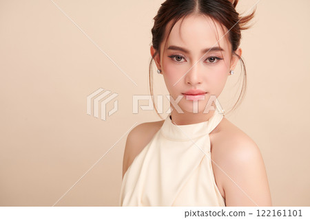 Beautiful young asian woman with clean fresh skin on beige background, Face care, Facial treatment, Cosmetology, beauty and spa, Asian women portrait. 122161101
