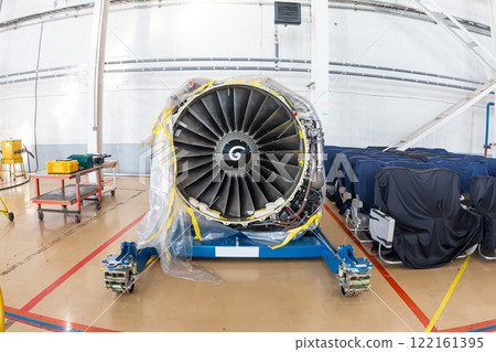 High-bypass turbofan aircraft engine in aviation hangar High-bypass turbofan aircraft engine in aviation hangar 122161395
