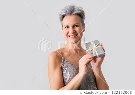 Smiling happy lady 50 years old with gray hair and short haircut looking at camera 122162008