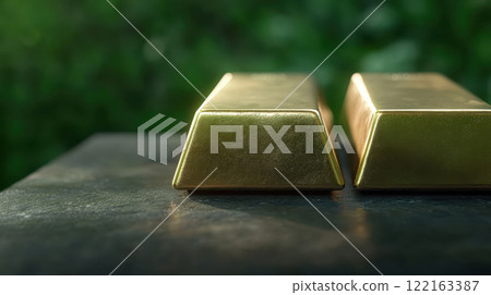 Captivating Close up of Gleaming Gold Bars on a Dark Natural Background 122163387