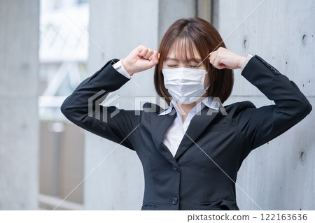 A businesswoman suffering from a headache A businesswoman suffering from a headache 122163636