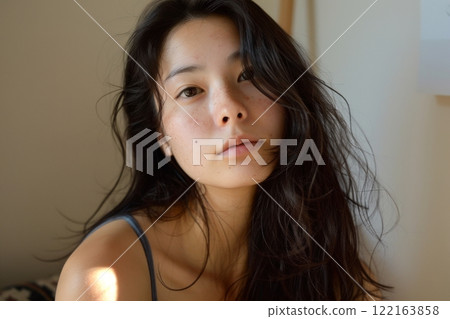 A bare-faced Japanese woman taking a selfie in her room (model, no makeup, bare skin) 122163858