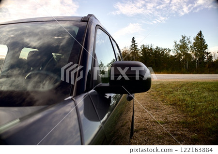 black car on the side of the road outside the city black car on the side of the road outside the city 122163884