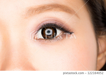 Close-up of a woman's eyes wearing colored contact lenses Close-up of a woman's eyes wearing colored contact lenses 122164052