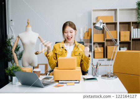 Small business entrepreneur SME freelance woman working at home office, BOX,tablet and laptop online, marketing, packaging 122164127