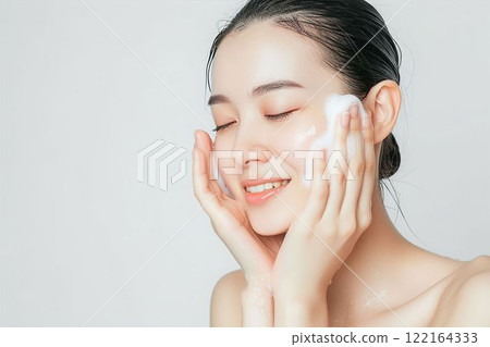 A beautiful Japanese woman with beautiful skin washing her face (skin care, beautiful skin, model) A beautiful Japanese woman with beautiful skin washing her face (skin care, beautiful skin, model) 122164333