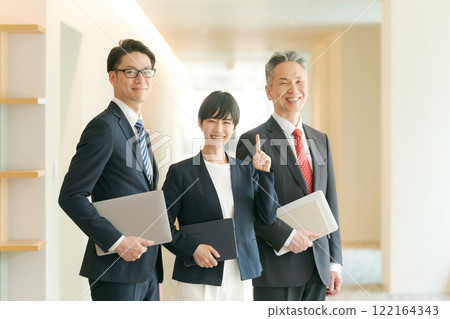 Business people lining up in an office corridor Business people lining up in an office corridor 122164343
