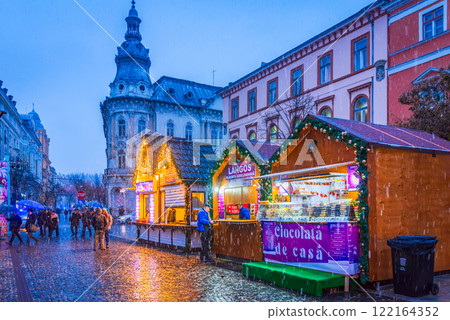 Cluj Christmas Market, illuminated stalls, holiday decorations, twinkling lights, cozy atmosphere, vibrant winter celebration in Transylvania, Romania. 122164352
