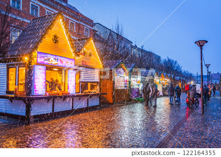 Cluj Christmas Market, illuminated stalls, holiday decorations, twinkling lights, cozy atmosphere, vibrant winter celebration in Transylvania, Romania. Cluj Christmas Market, illuminated stalls, holiday decorations, twinkling lights, cozy atmosphere, vibrant winter celebration in Transylvania, Romania. 122164355