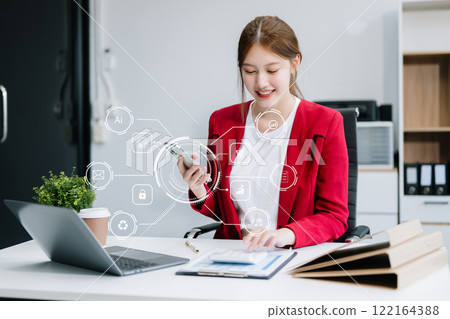 businesswoman hand working with mobile phone and modern compute with VR icon diagram. Digital marketing media in virtual screen businesswoman hand working with mobile phone and modern compute with VR icon diagram. Digital marketing media in virtual screen 122164388