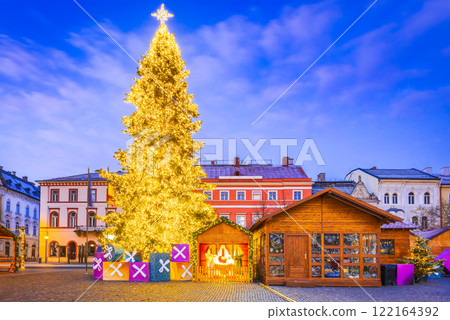 Cluj Christmas Market, illuminated stalls, holiday decorations, twinkling lights, cozy atmosphere, vibrant winter celebration in Transylvania, Romania. Cluj Christmas Market, illuminated stalls, holiday decorations, twinkling lights, cozy atmosphere, vibrant winter celebration in Transylvania, Romania. 122164392