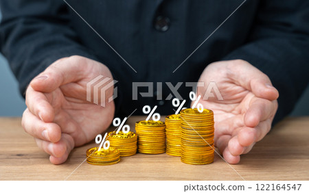 A man protects with palms growing deposits with interest. Investments and guaranteed profits. Save tar and make passive profits. 122164547