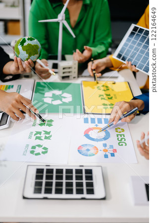 Business team people planning hand using laptop for working technology and business Net zero and carbon neutral concept. 122164649