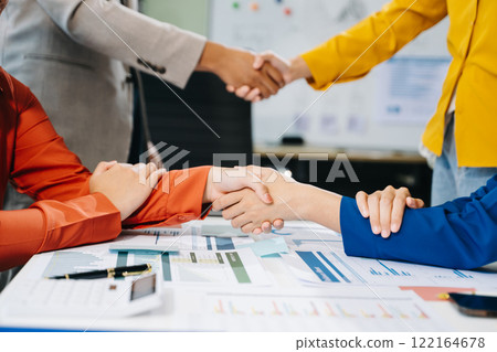 Two confident business man shaking hands during a meeting in the office, success, dealing 122164678