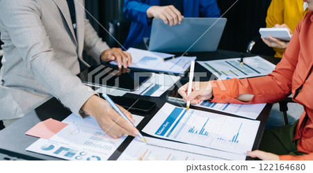 Business people making presentation with his colleagues and business smartphone, tablet digital computer 122164680