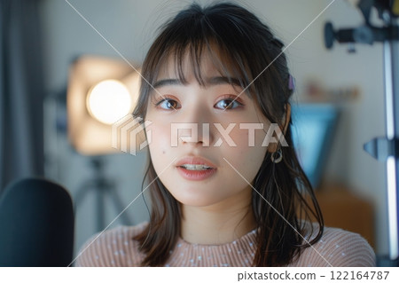 A Japanese woman filming content for distribution in her room (live streaming, YouTube, creator) 122164787