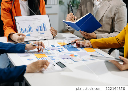 Business team meeting present.professional investor working with  Finance managers task. with laptop smart phone and digital tablet 122164858