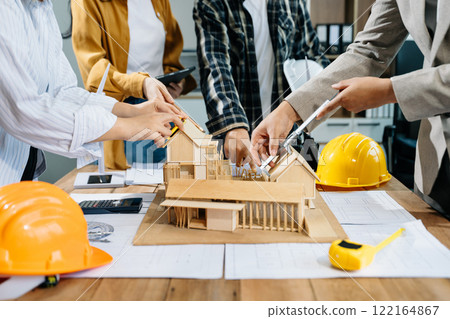 Engineer desk with object paper and tablet with blurry engineer teamwork hardworking 122164867