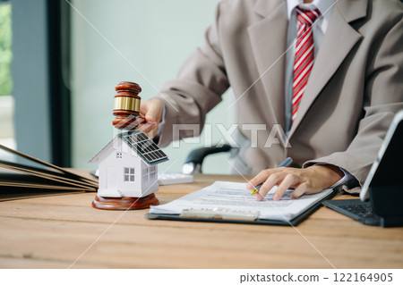 Real Estate Lawyer And House Foreclosure Law. House model, hammer judge gavel on table with white background. Foreclosure, bankruptcy concept 122164905