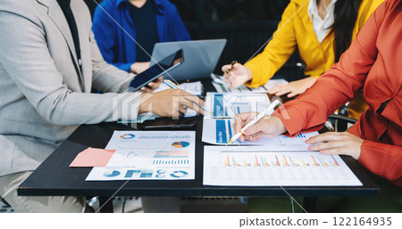 Business people making presentation with his colleagues and business smartphone, tablet digital computer 122164935