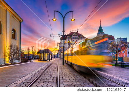 Oradea, Romania. Tram station in Union Square, beautiful city architecture in Crisana, Transylvania. 122165047