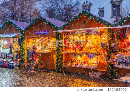 Cluj Christmas Market, illuminated stalls, holiday decorations, twinkling lights, cozy atmosphere, vibrant winter celebration in Transylvania, Romania. 122165052