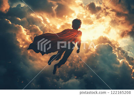 A boy dressed as a superhero with a red cape flies high in the clouds. Children's Day concept. 122165208