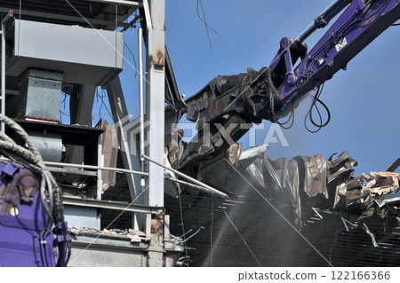 Factory demolition site: A scene of a large-scale press in operation 122166366