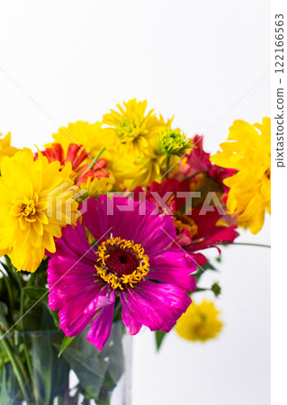 A summer bouquet featuring colorful Zinnia and Rudbeckia Goldquelle flowers adds vibrant beauty to home decoration, perfect for a seasonal and cheerful floral arrangement 122166563