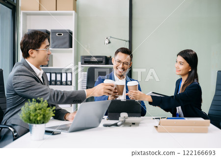 Office colleagues have a casual discussion. During a meeting in a conference room, a group of business teem Office colleagues have a casual discussion. During a meeting in a conference room, a group of business teem 122166693