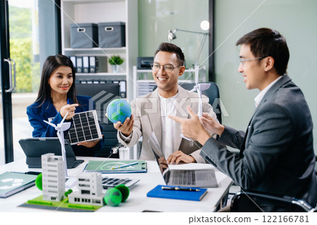 Business people having consultation about wind energy at company office. Business team discussing about windmill and alternative green enery. Net zero 122166781