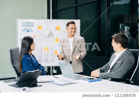 Business team discuss at meeting room. working together with laptop ,tablet and smart phone on desk Financial accountant Business team discuss at meeting room. working together with laptop ,tablet and smart phone on desk Financial accountant 122166876