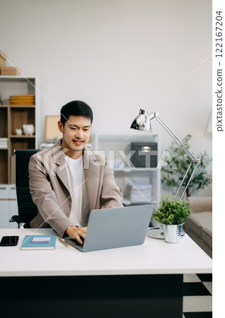 business man executive manager looking at laptop watching online webinar training or having virtual meeting video conference doing market research working business man executive manager looking at laptop watching online webinar training or having virtual meeting video conference doing market research working 122167204